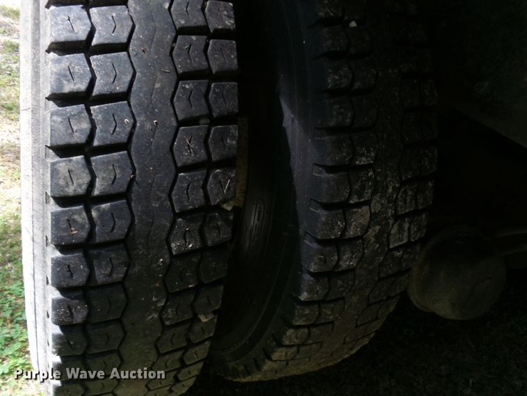 image for item DH3797 2004 Sterling L-Line  flatbed truck with forklift