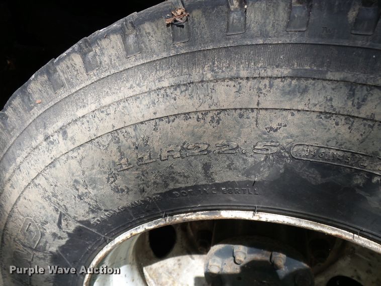 image for item DH3797 2004 Sterling L-Line  flatbed truck with forklift