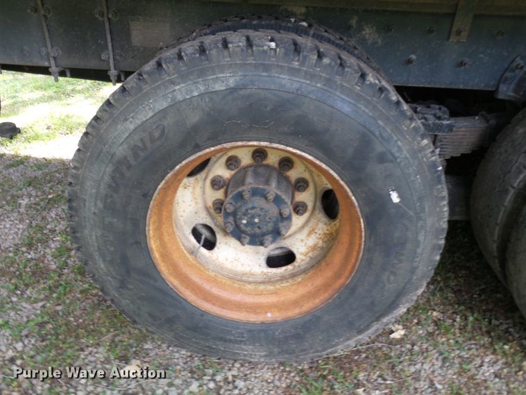 image for item DH3797 2004 Sterling L-Line  flatbed truck with forklift