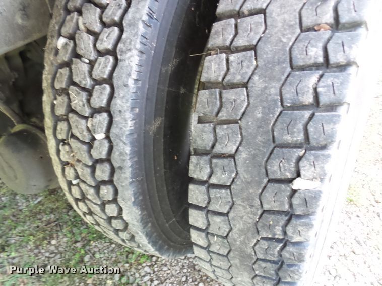 image for item DH3797 2004 Sterling L-Line  flatbed truck with forklift