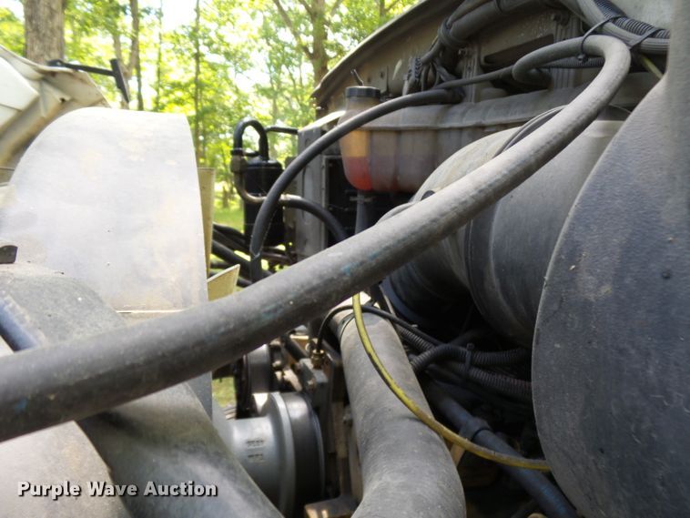 image for item DH3797 2004 Sterling L-Line  flatbed truck with forklift