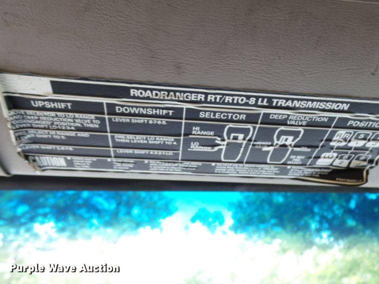 image for item DH3797 2004 Sterling L-Line  flatbed truck with forklift