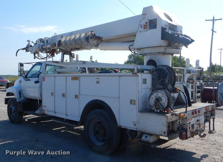 image for item HM9558 2000 GMC C7500  digger derrick truck