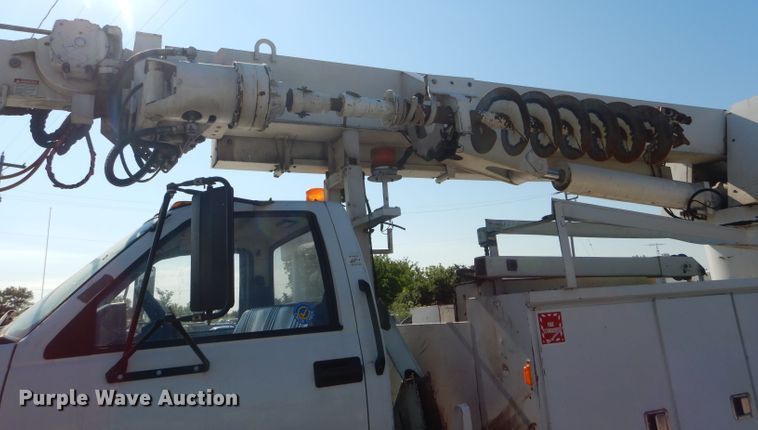 image for item HM9558 2000 GMC C7500  digger derrick truck