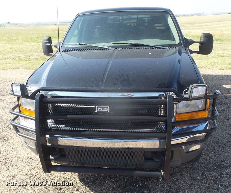 image for item DD0431 2000 Ford F250 Super Duty XLT  SuperCab flatbed pickup truck