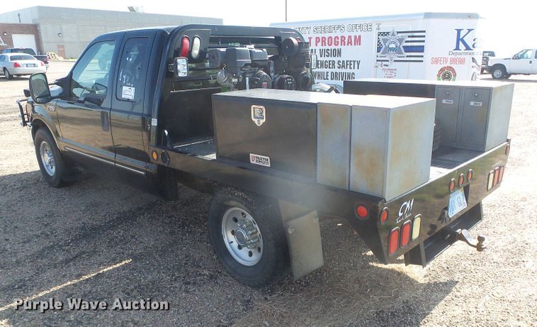 image for item DD0431 2000 Ford F250 Super Duty XLT  SuperCab flatbed pickup truck