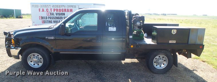 image for item DD0431 2000 Ford F250 Super Duty XLT  SuperCab flatbed pickup truck