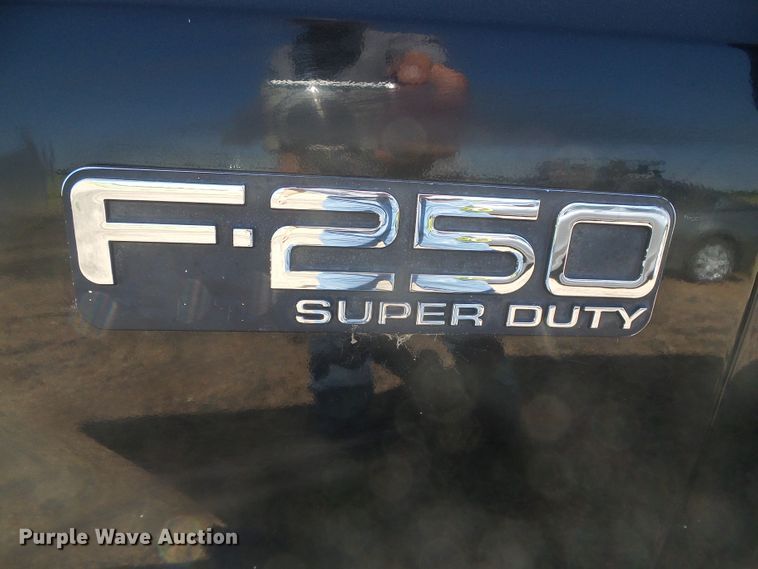 image for item DD0431 2000 Ford F250 Super Duty XLT  SuperCab flatbed pickup truck