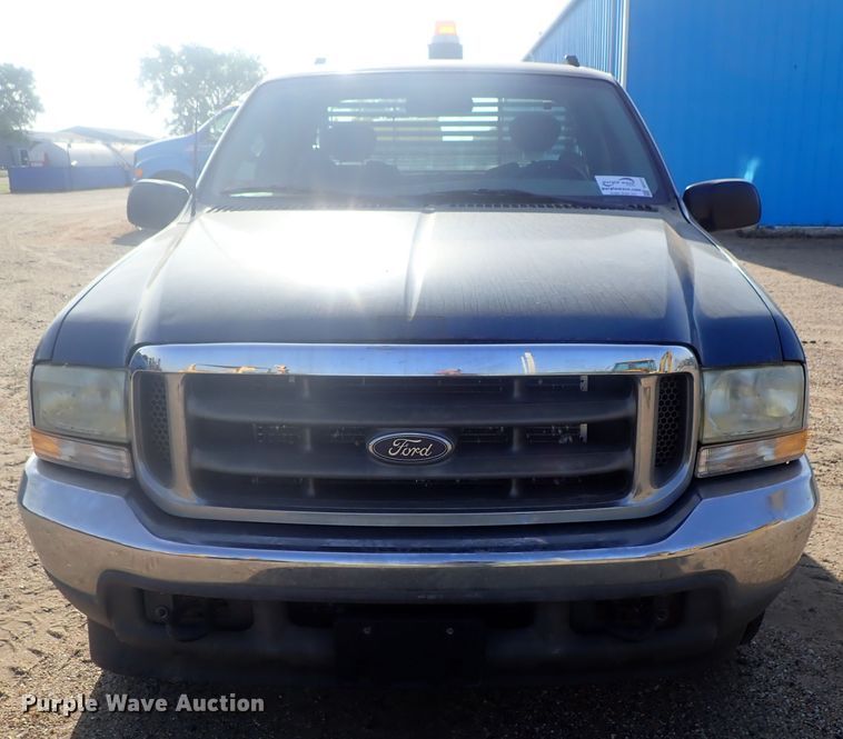 image for item DG2312 2002 Ford F250 Super Duty  SuperCab flatbed pickup truck