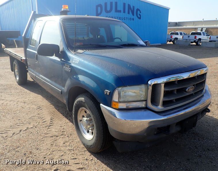 image for item DG2312 2002 Ford F250 Super Duty  SuperCab flatbed pickup truck