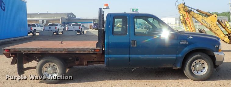 image for item DG2312 2002 Ford F250 Super Duty  SuperCab flatbed pickup truck