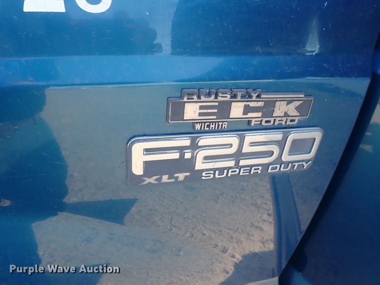 image for item DG2312 2002 Ford F250 Super Duty  SuperCab flatbed pickup truck