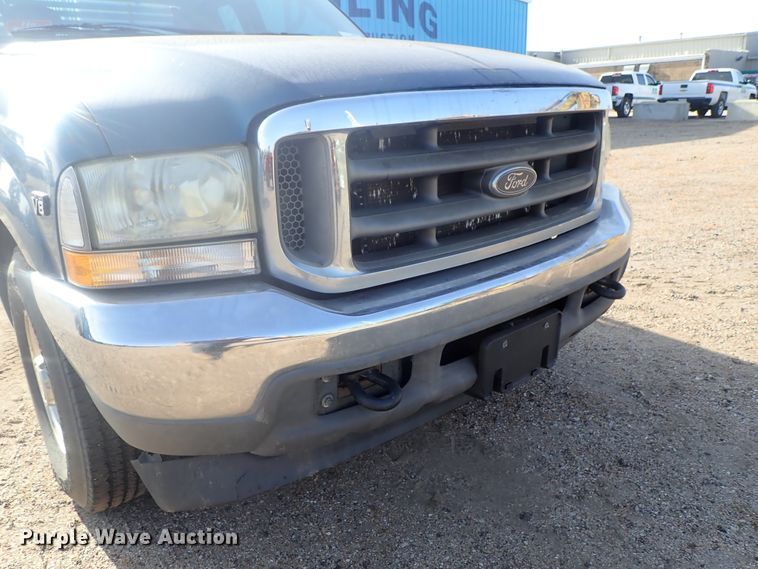 image for item DG2312 2002 Ford F250 Super Duty  SuperCab flatbed pickup truck