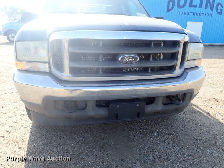 image for item DG2312 2002 Ford F250 Super Duty  SuperCab flatbed pickup truck