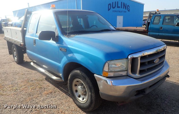 image for item DG2314 2004 Ford F250 Super Duty  SuperCab flatbed pickup truck