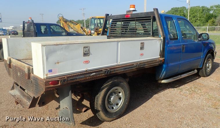 image for item DG2314 2004 Ford F250 Super Duty  SuperCab flatbed pickup truck