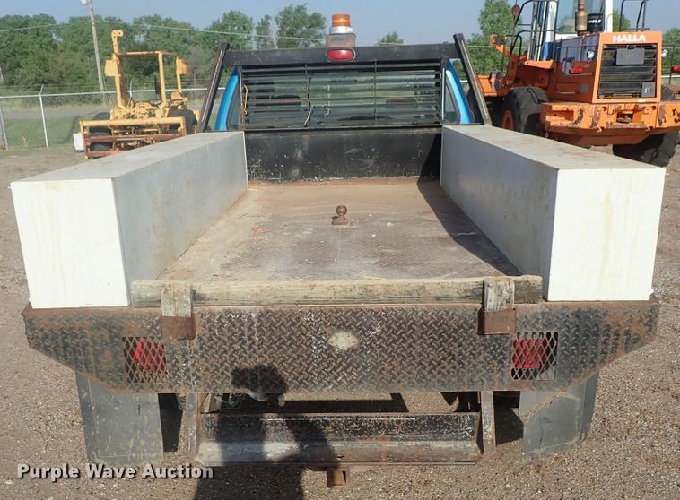 image for item DG2314 2004 Ford F250 Super Duty  SuperCab flatbed pickup truck