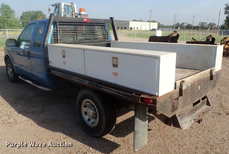 image for item DG2314 2004 Ford F250 Super Duty  SuperCab flatbed pickup truck