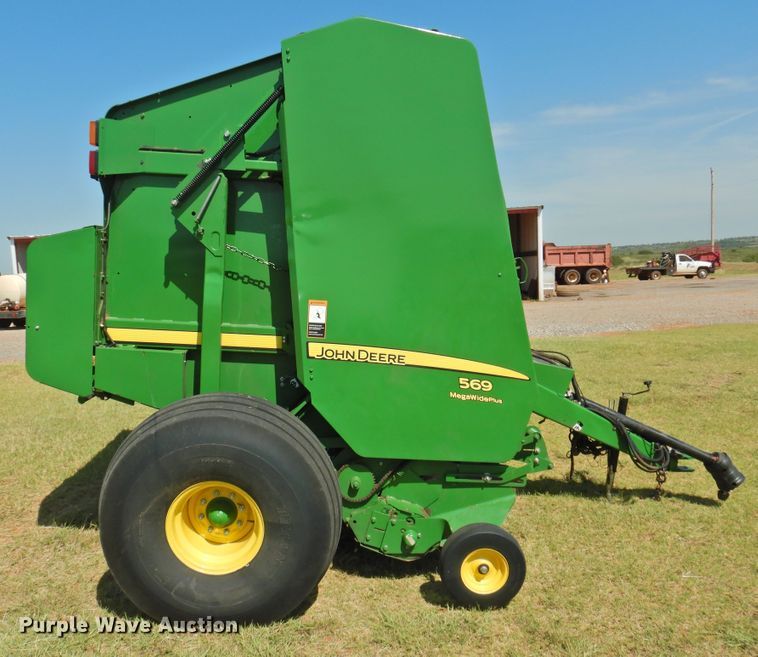 image for item DG1432 2015 John Deere 569 Mega Wide Plus  round baler