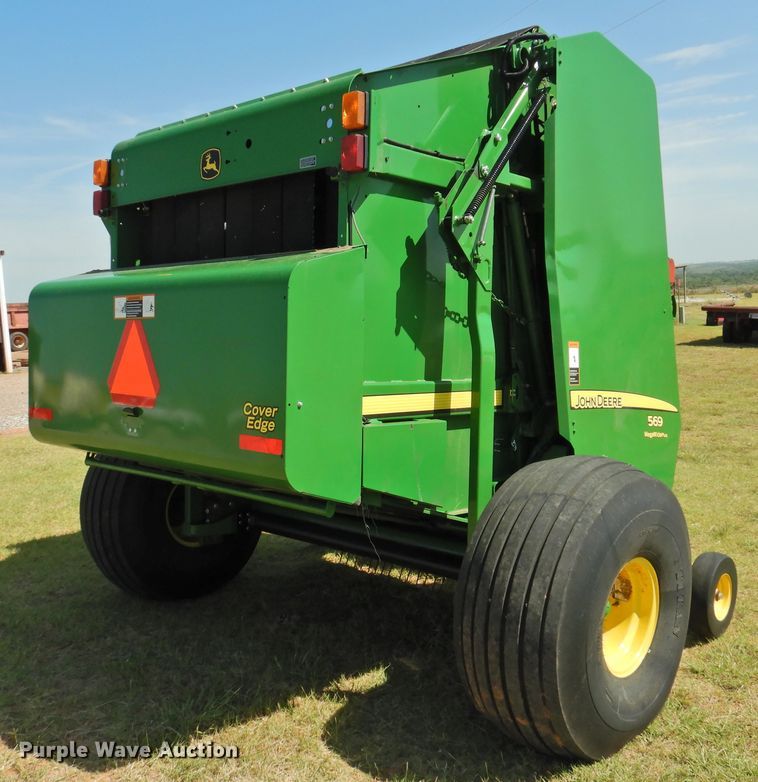 image for item DG1432 2015 John Deere 569 Mega Wide Plus  round baler