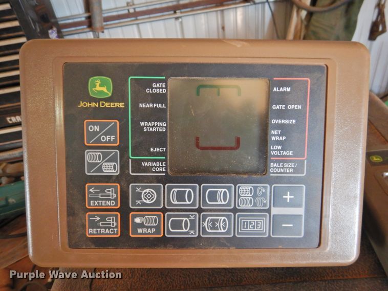 image for item DG1432 2015 John Deere 569 Mega Wide Plus  round baler