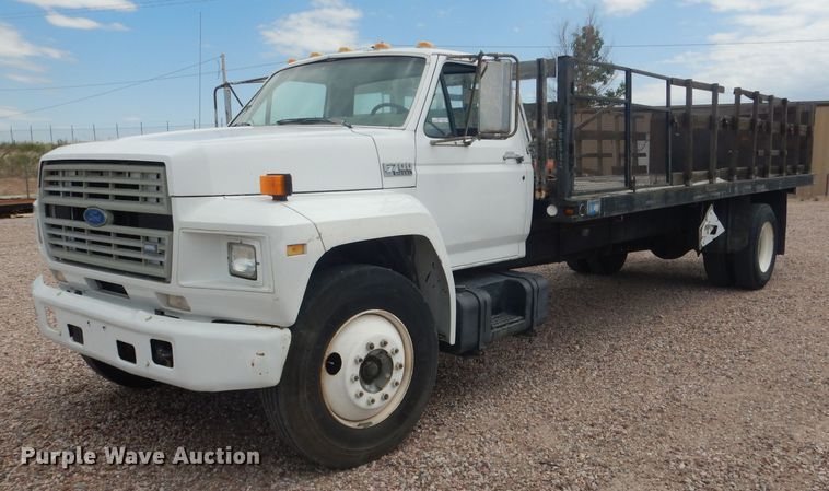 image for item FA9365 1993 Ford F700  flatbed truck