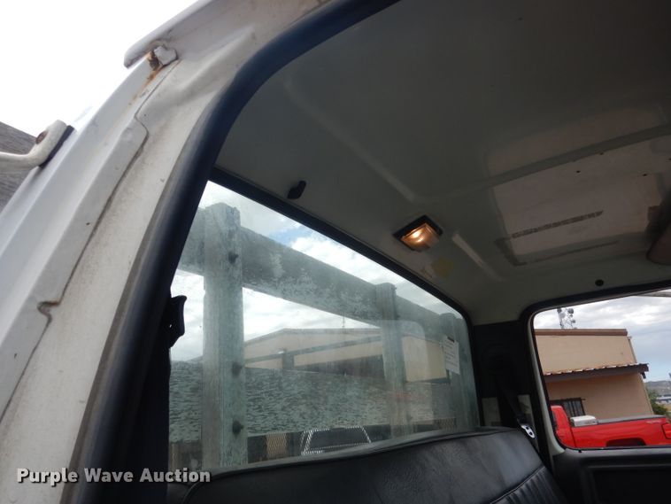 image for item FA9365 1993 Ford F700  flatbed truck