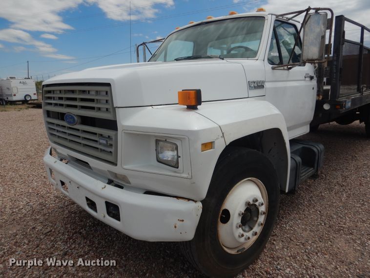 image for item FA9365 1993 Ford F700  flatbed truck