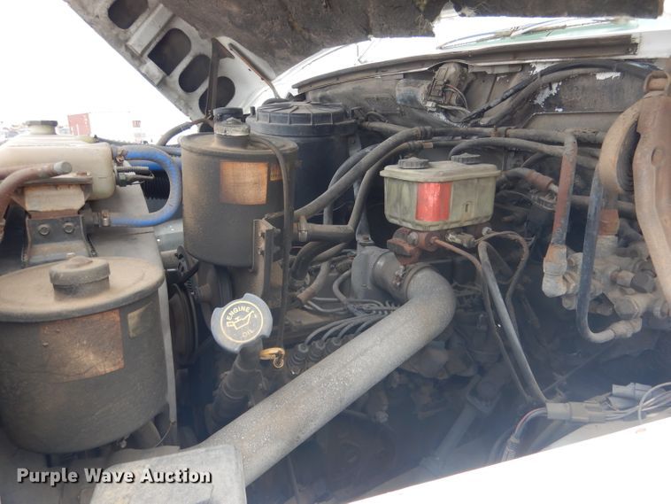 image for item FA9365 1993 Ford F700  flatbed truck