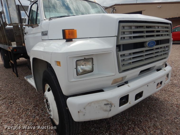 image for item FA9365 1993 Ford F700  flatbed truck
