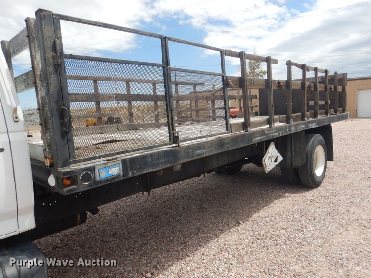 image for item FA9365 1993 Ford F700  flatbed truck