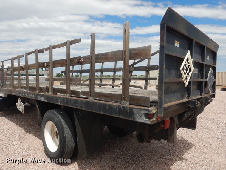 image for item FA9365 1993 Ford F700  flatbed truck