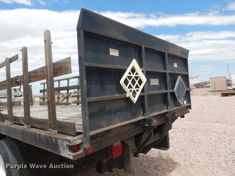 image for item FA9365 1993 Ford F700  flatbed truck