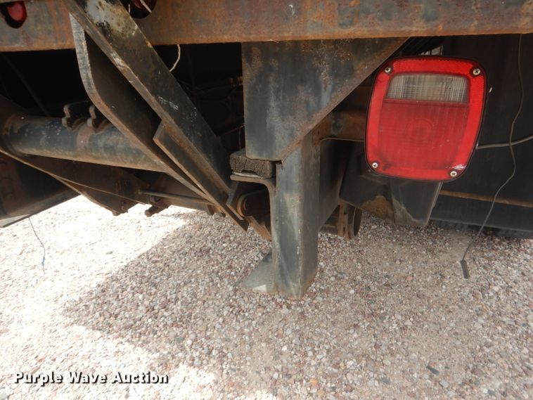 image for item FA9365 1993 Ford F700  flatbed truck
