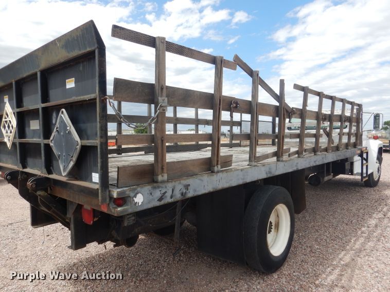 image for item FA9365 1993 Ford F700  flatbed truck