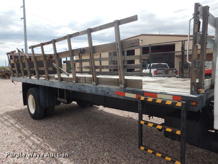 image for item FA9365 1993 Ford F700  flatbed truck