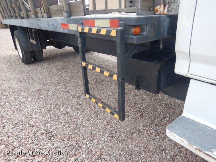 image for item FA9365 1993 Ford F700  flatbed truck