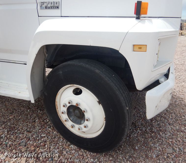 image for item FA9365 1993 Ford F700  flatbed truck