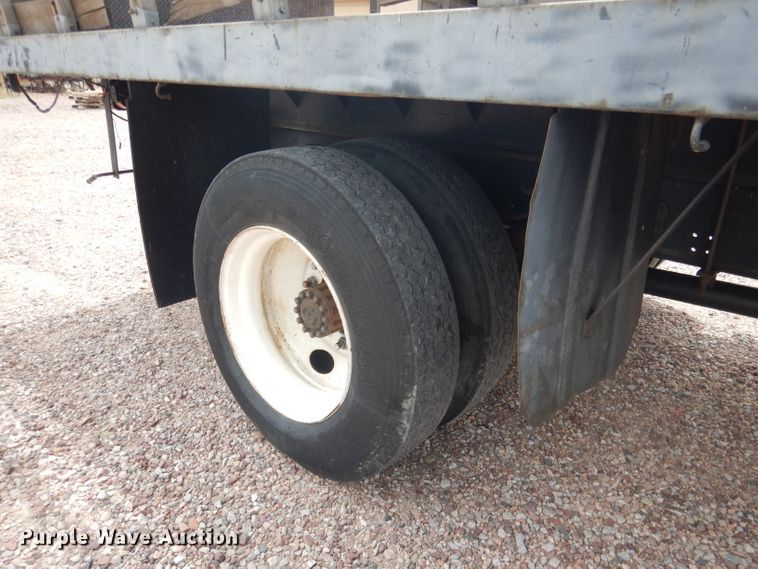 image for item FA9365 1993 Ford F700  flatbed truck