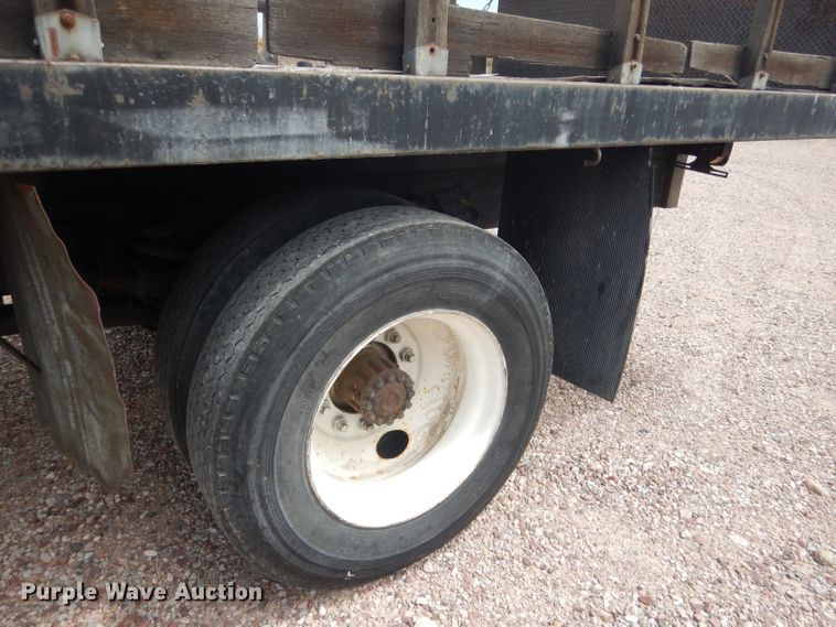 image for item FA9365 1993 Ford F700  flatbed truck
