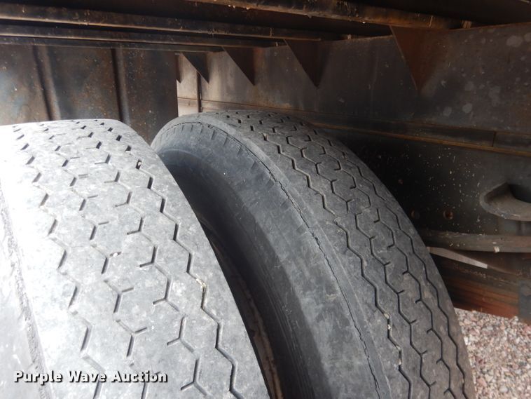 image for item FA9365 1993 Ford F700  flatbed truck