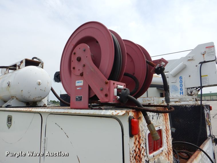 image for item HJ9827 1995 Peterbilt 330  utility bed truck with crane