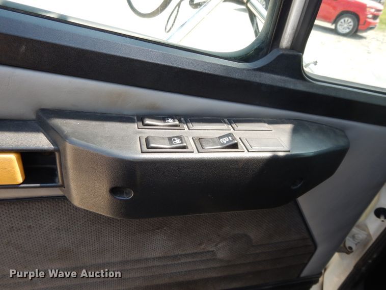 image for item DG7986 1999 Freightliner FL60  flatbed truck