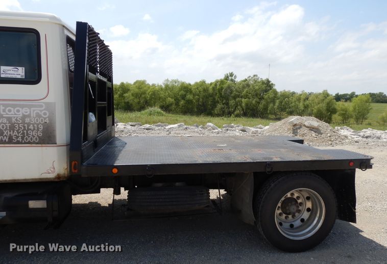 image for item DG7986 1999 Freightliner FL60  flatbed truck