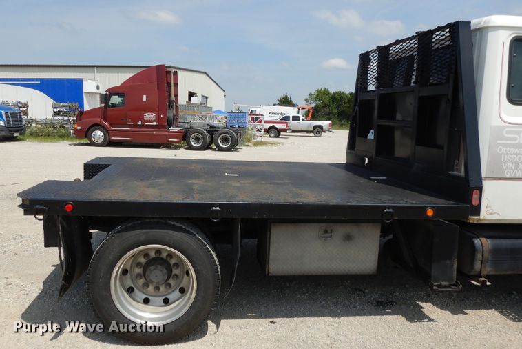 image for item DG7986 1999 Freightliner FL60  flatbed truck