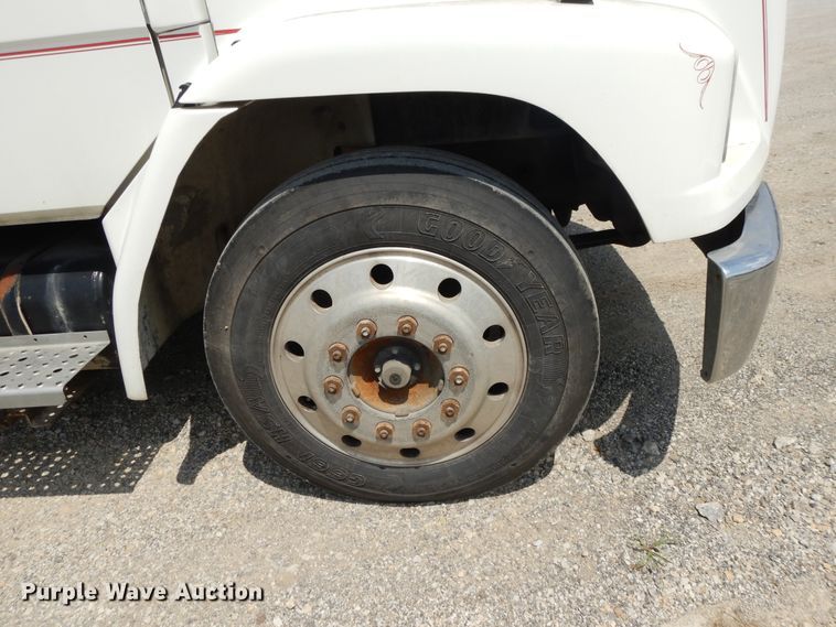 image for item DG7986 1999 Freightliner FL60  flatbed truck