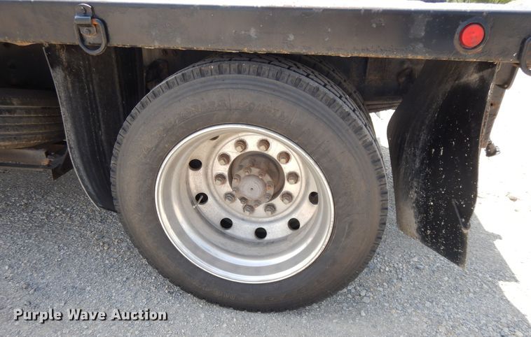 image for item DG7986 1999 Freightliner FL60  flatbed truck