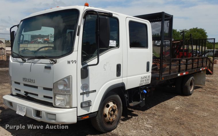 image for item DJ3474 2011 Isuzu NPR  flatbed truck