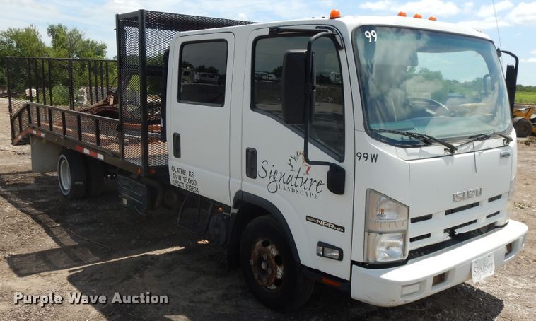 image for item DJ3474 2011 Isuzu NPR  flatbed truck