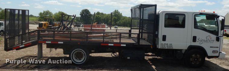 image for item DJ3474 2011 Isuzu NPR  flatbed truck